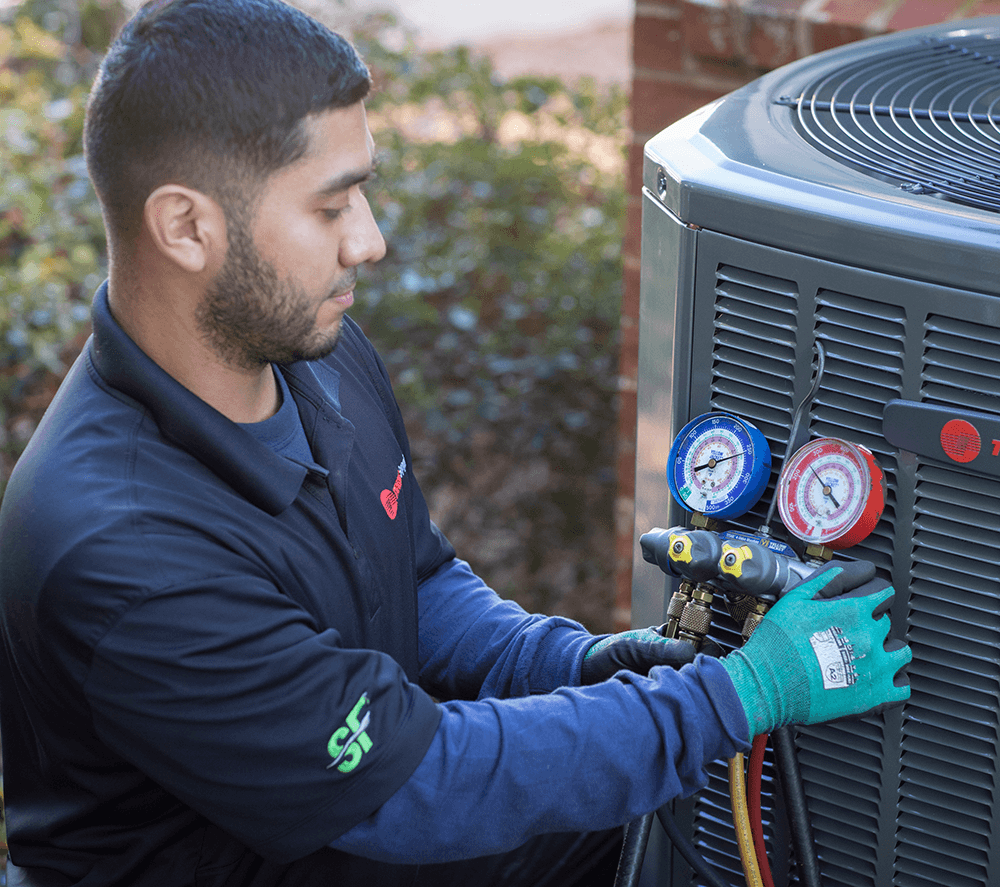 Air Conditioning Repair Near Me (an HVAC technician working on an AC unit)