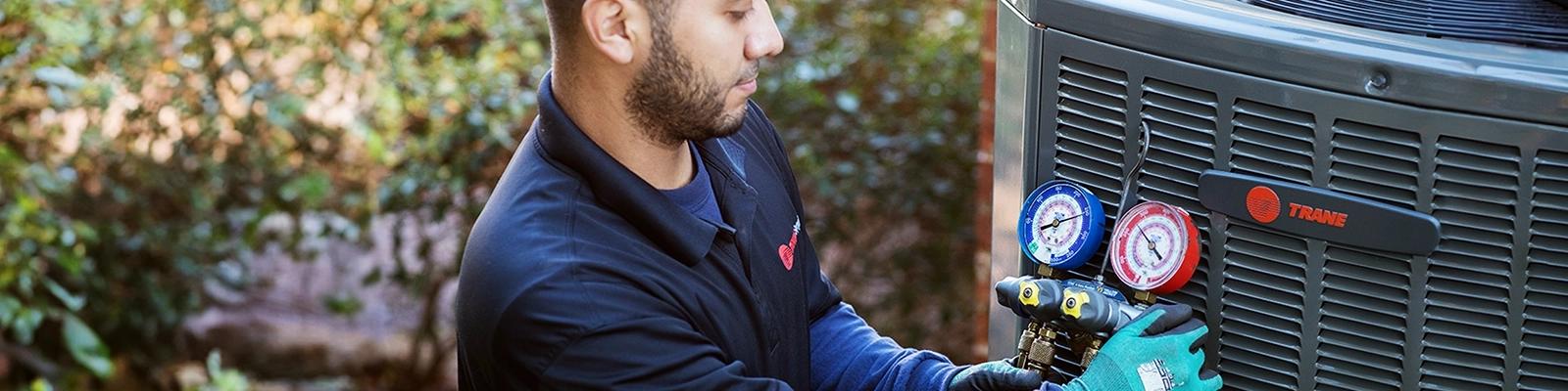 HVAC Technician Working on an Outdoor Unit