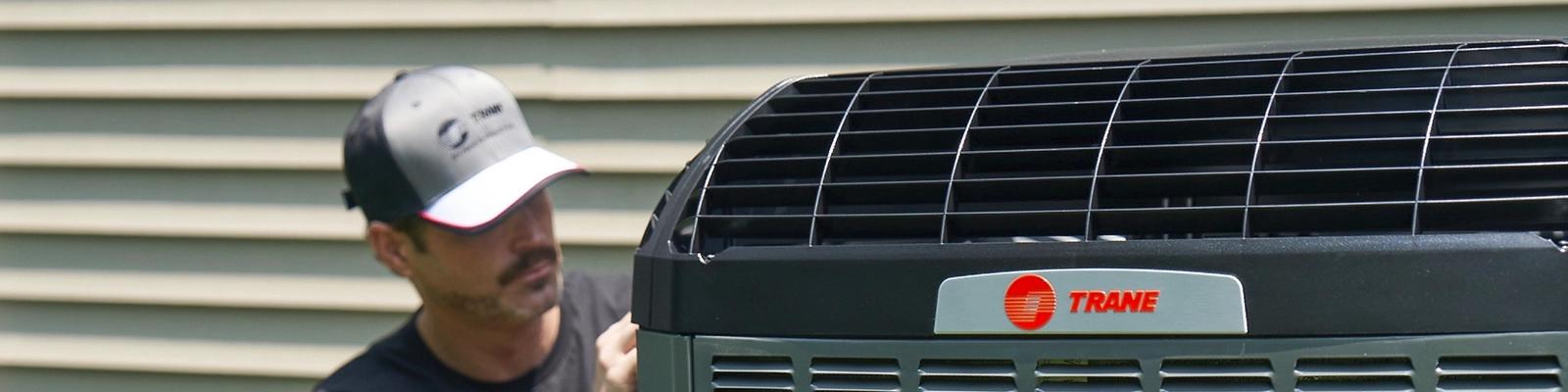 HVAC Technician Working On a Variable Speed System
