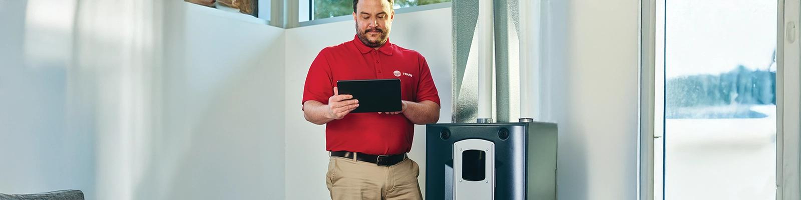 HVAC Technician Working on an Indoor Air Handler
