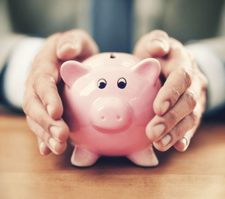 Man’s Hands Holding a Piggy Bank